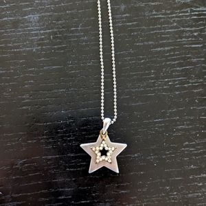 Silver tone star necklace